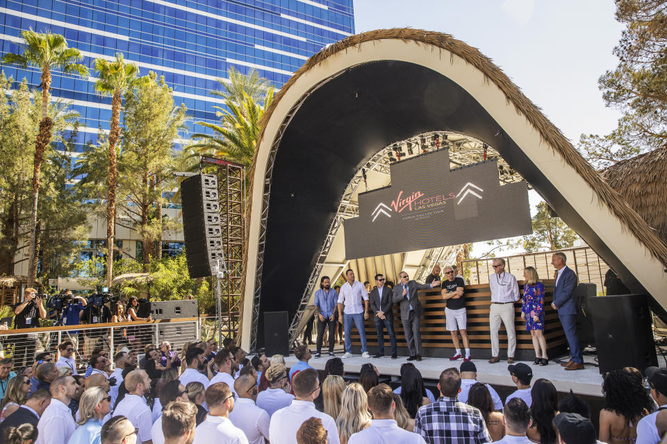 Sir Richard Branson, fourth from right, founder of Virgin Group, is introduced by Richard "Boz" Bosworth, owner of Virgin Hotels Las Vegas, during the "Unstoppable Weekend" kickoff party at Virgin Hotels Las Vegas on Thursday, June 10, 2021. (Benjamin Hager/Las Vegas Review-Journal via AP)