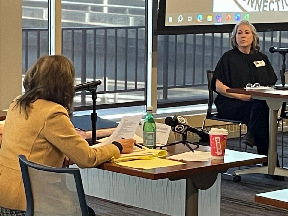 Attorney Deborah Stevenson asks Killingly BOE Vice Chair Kelly Martin a question at the district's 10-4b hearing.