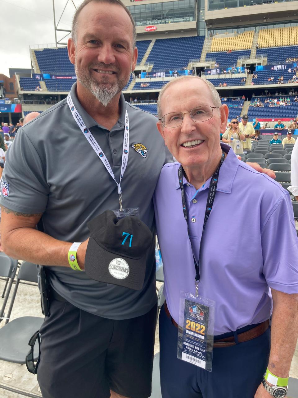 Former Jaguars player and radio analyst Jeff Lageman at Hall of Fame ceremony with his coach, Tom Coughlin, to honor Tony Boselli.