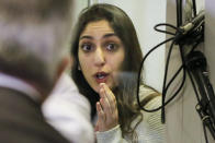 Israeli Naama Issachar gestures during an appeal hearings in a courtroom in Moscow, Russia, Thursday, Dec. 19, 2019. An Israeli backpacker serving prison time in Russia on a drug conviction is appealing her case and says she was wasn't provided a translator or lawyer after being detained at a Moscow airport. She was arrested in April in Moscow's Sheremetyevo Airport, where she was transferring flights en route from India to Israel. More than nine grams of hashish were found in her luggage. She was later sentenced to 7 1/2 years. (AP Photo/Alexander Zemlianichenko Jr.)