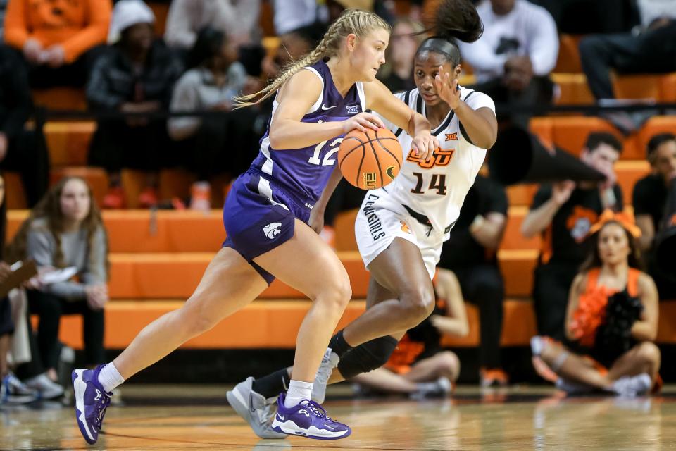 Oklahoma State's Taylen Collins (14) has been a key piece of the Cowgirls' rise this season, thanks to her versatility on both ends of the floor.