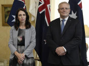 New Zealand Prime Minister Jacinda Ardern, left, stands with Australian Prime Minister Scott Morrison during the signing of the Indigenous Collaboration Arrangement at Admiralty House in Sydney, Friday, Feb. 28, 2020. Ardern called out her Australian counterpart Morrison at an extraordinarily abrasive joint news conference Friday for his country's rigid policy of deporting foreign criminals to homelands they left as children. Ardern called the policy unfair and corrosive to the near-neighbors' ties, but Morrison publicly held firm. (Bianca De Marchi/Pool Photo via AP)