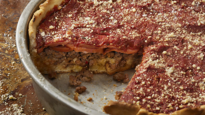 Deep dish pizza covered sauce
