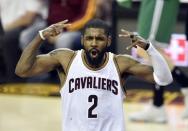 May 23, 2017; Cleveland, OH, USA; Cleveland Cavaliers guard Kyrie Irving (2) reacts after making a three-point basket at the end of the third quarter against the Boston Celtics in game four of the Eastern conference finals of the NBA Playoffs at Quicken Loans Arena. Mandatory Credit: David Richard-USA TODAY Sports