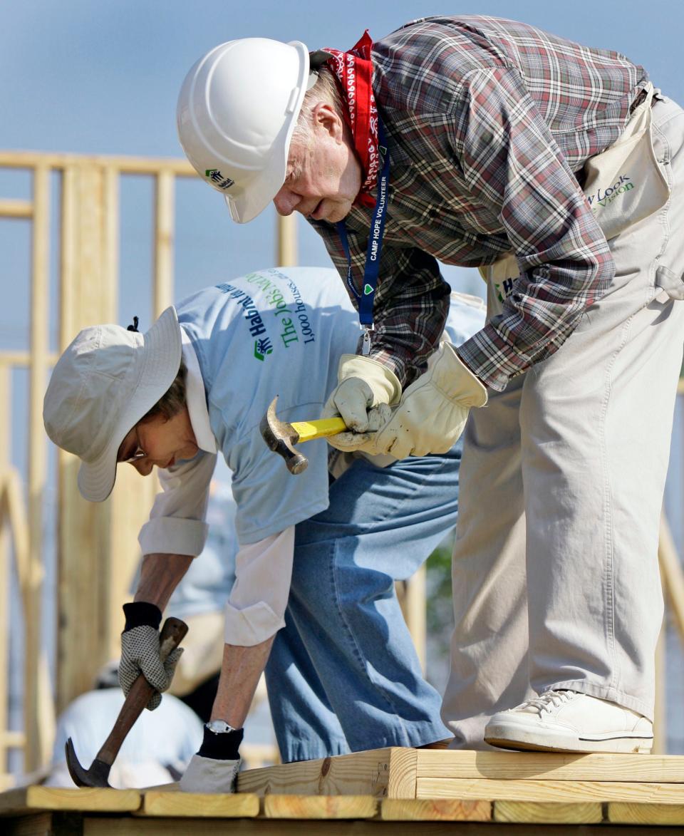 Jimmy Carter, right, Rosalynn Carter help build a Habitat for Humanity house in Violet, Louisiana on May 21, 2007.