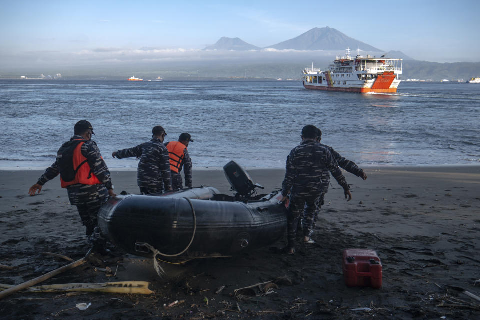 Indonesian Navy personnel prepare for a search rescue operation for victims of the sinking ferry KMP Yunice near Gilimanuk Port on Bali Island, Indonesia, Wednesday, June 30, 2021. Rescuers on Wednesday were searching for people missing in rough seas overnight. (AP Photo/Fauzy Chaniago)