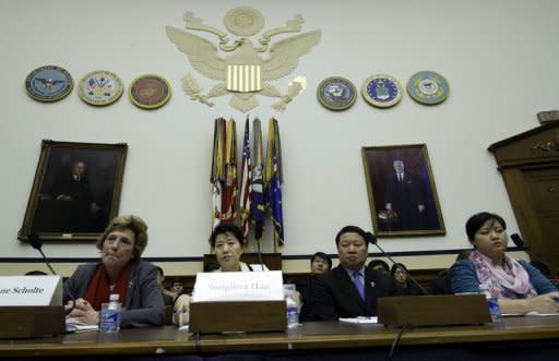 Songhwa Han (2nd L), former North Korean refugee detained in China, repatriated to North Korea, and detained there and Jinhye Jo (R), who suffered the same fate, testify before the US House Foreign Affairs Committee Congressional Executive Commission on China, on Capitol Hill In Washington, DC