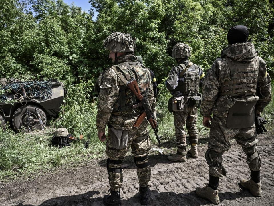 Ukrainian servicemen get ready to move towards the front line at a checkpoint near the city of Lysychansk (AFP/Getty)