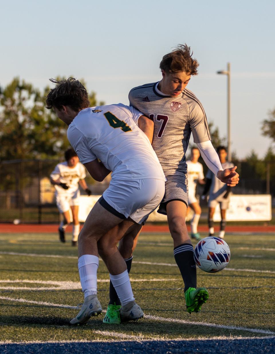 Caravel’s Jacob Wojciechowski (17) collides with Saint Mark’s Michael Smyth.