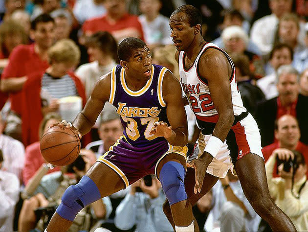 Magic Johnson and Clyde Drexler. (Getty Images)