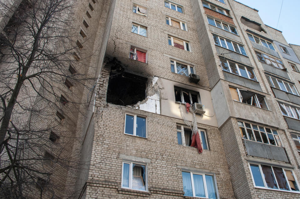 Damages are seen in an apartments building hit by shelling in Kharkiv, Ukraine, Sunday, March 20, 2022. (AP Photo/Andrew Marienko)