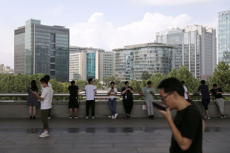 FILE PHOTO: People are seen at Beijing's tech hub Zhongguancun