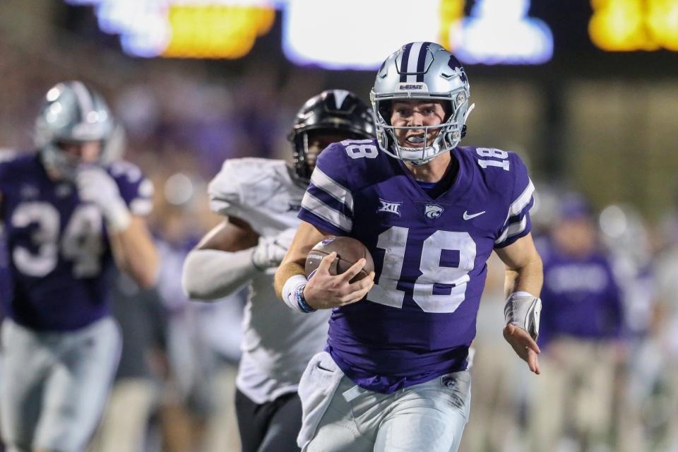 Kansas State quarterback Will Howard (18) runs away from the UCF defense for a 31-yard touchdown in the fourth quarter Saturday night at Bill Snyder Family Stadium.