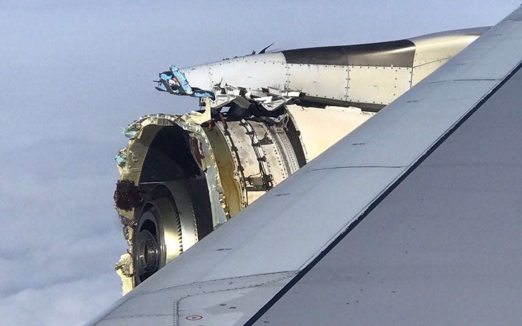 The crumpled engine of the Air France A380 superjumbo is seen in this photo taken by one of the passengers on board. - AFP