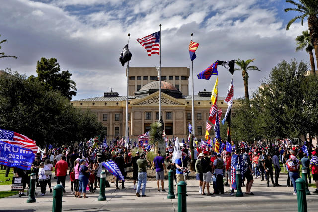 FILE - Supporters of President Donald Trump rally outside the state Capitol, Nov. 7, 2020, in Phoenix. (AP Photo/Matt York, File)