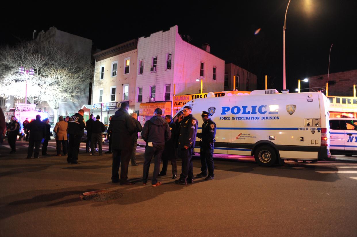 NYPD are pictured at the scene on Lorillard Place in the Bronx, New York where a police officer was shot on Tuesday, Jan. 18, 2022.