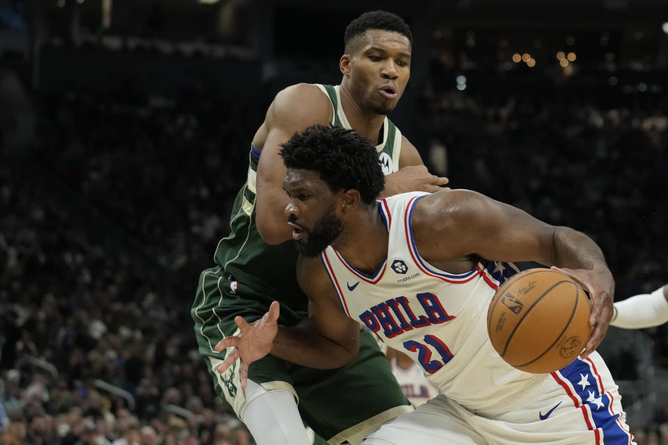 MILWAUKEE, WISCONSIN - OCTOBER 26: Giannis Antetokounmpo #34 of the Milwaukee Bucks defends Joel Embiid #21 of the Philadelphia 76ers in the second half at Fiserv Forum on October 26, 2023 in Milwaukee, Wisconsin. NOTE TO USER: User expressly acknowledges and agrees that, by downloading and or using this photograph, User is consenting to the terms and conditions of the Getty Images License Agreement. (Photo by Patrick McDermott/Getty Images)