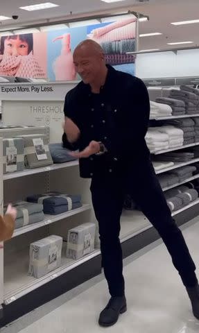 <p>Dwayne Johnson/Instagram</p> Dwayne Johnson playing rock, paper, scissors with a fan at Target