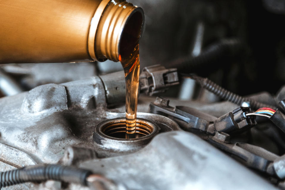 oil being poured into a car