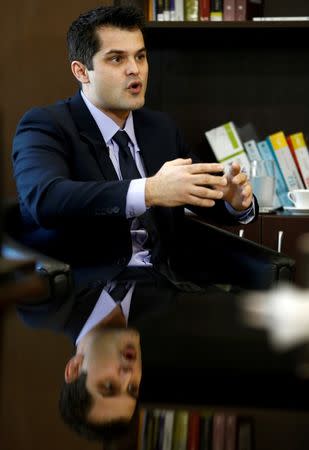 Brazilian prosecutor Rafael Brum Miron gestures during an interview with Reuters in Curitiba, Brazil, July 25, 2016. REUTERS/Rodolfo Buhrer