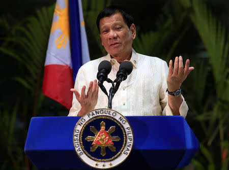 Philippine President Rodrigo Duterte gestures while answering questions during a news conference upon arrival from a trip to Myanmar and Thailand at an international airport in Manila, Philippines March 23, 2017. REUTERS/Romeo Ranoco