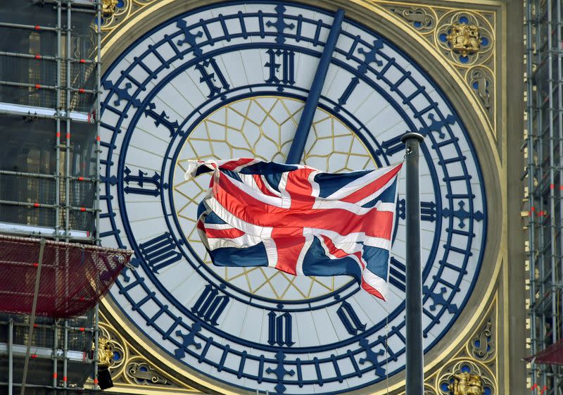 FILE PHOTO: British Union Jack flag flies in front of the clock face of Big Ben in London