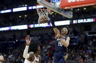 New Orleans Pelicans center Jaxson Hayes (10) dunks the ball over Cleveland Cavaliers guard Kevin Porter Jr. during the second half of an NBA basketball game in New Orleans, Friday, Feb. 28, 2020. (AP Photo/Rusty Costanza)