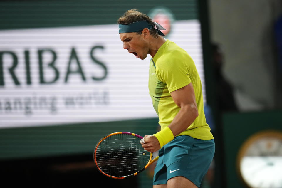 Spain's Rafael Nadal clenches his fist after scoring a point against Serbia's Novak Djokovic during their quarterfinal match at the French Open tennis tournament in Roland Garros stadium in Paris, France, Tuesday, May 31, 2022. (AP Photo/Christophe Ena)