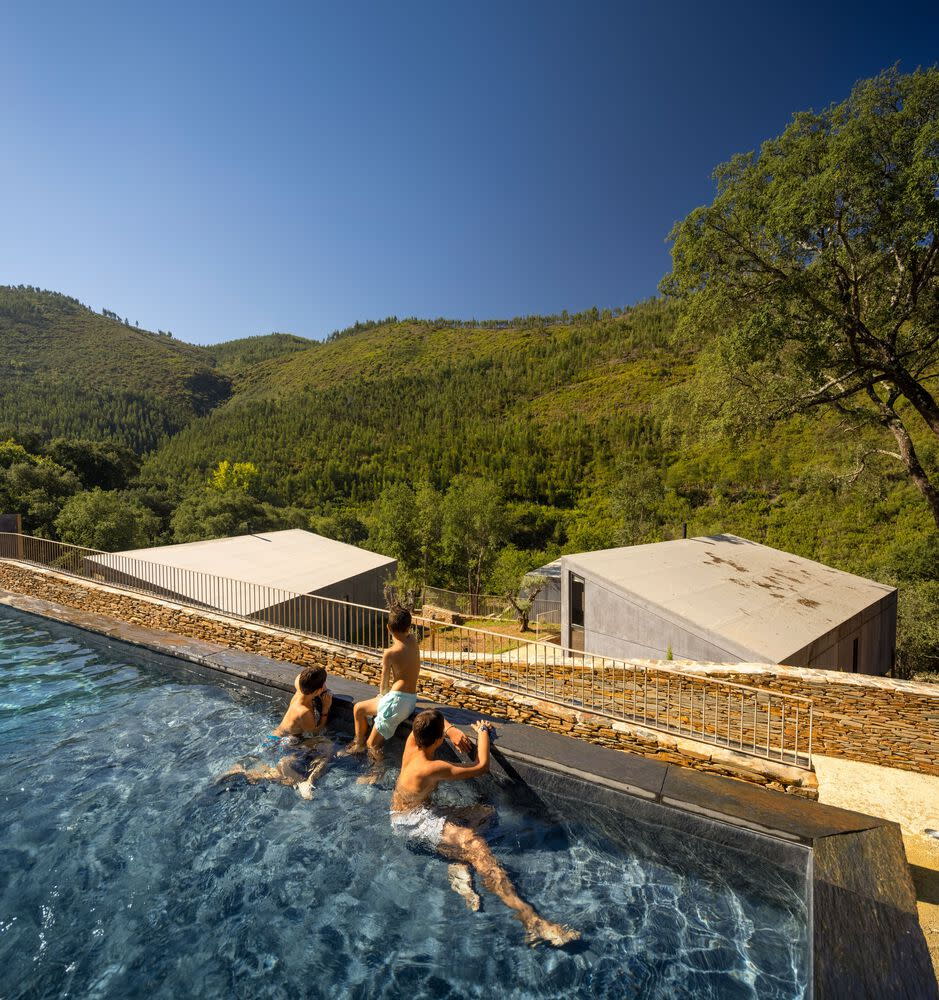 Young boys play in a rooftop pool inside Portugal's Paradinha Village Resort. 