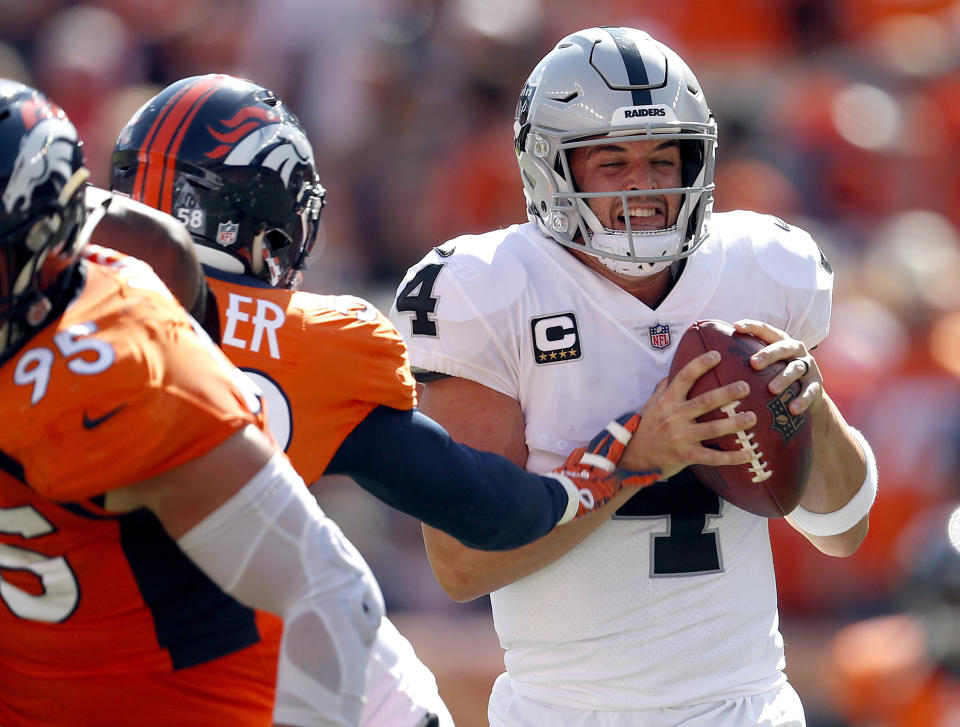 Oakland Raiders quarterback Derek Carr (4) is sacked by Denver Broncos linebacker Von Miller during the first half of an NFL football game, Sunday, Sept. 16, 2018, in Denver. (AP Photo/David Zalubowski)