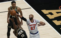 New York Knicks' Taj Gibson (67) blocks Atlanta Hawks' Clint Capela (15) from shooting during the first half in Game 4 of an NBA basketball first-round playoff series Sunday, May 30, 2021, in Atlanta. (AP Photo/Brynn Anderson)