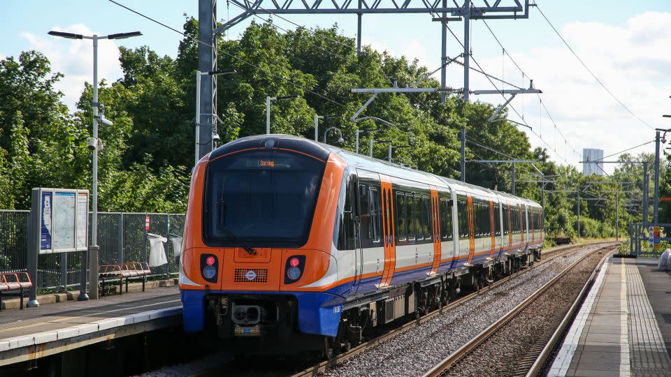 A London Overground train in orange livery. - Dinendra Haria/SOPA Images/hutterstock