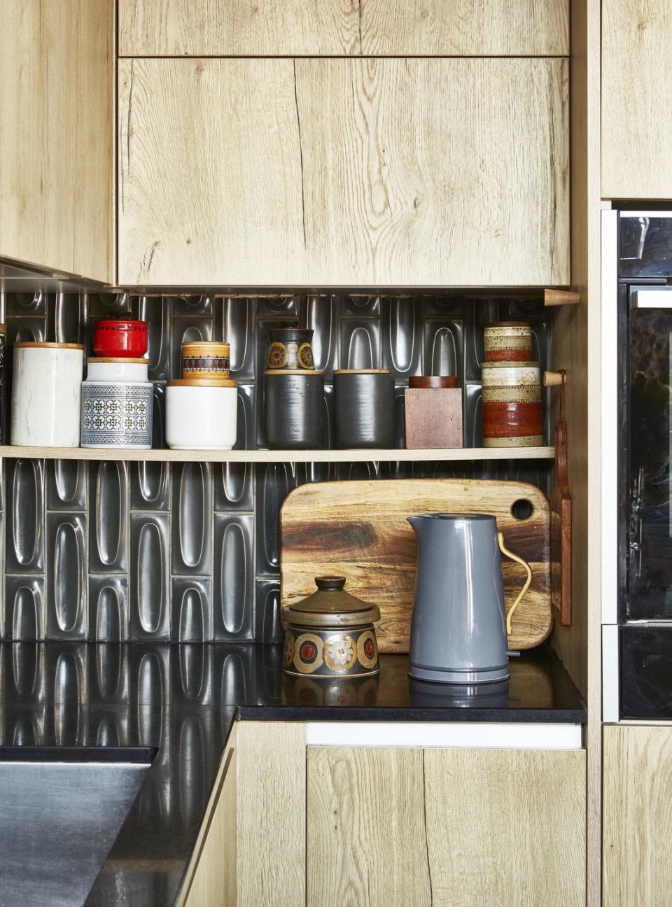 a shelf with jars and containers on it