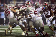 Indiana running back Stephen Carr (5) is tackled by Ohio State defenders Tommy Eichenberg (35) and Lathan Ransom (12) in the second half of an NCAA college football game in Bloomington, Ind., Saturday, Oct. 23, 2021. (AP Photo/AJ Mast)