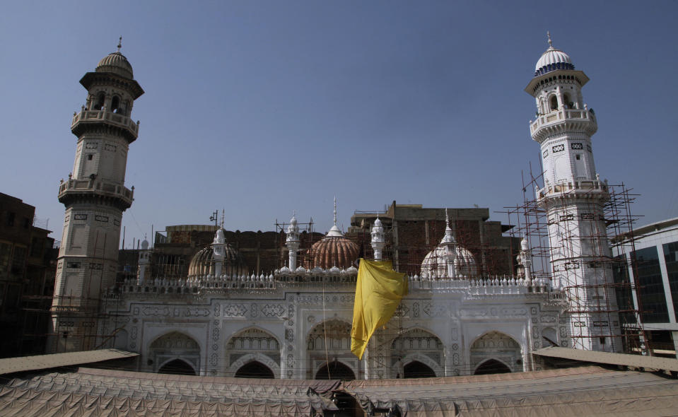 Renovation work is going on at the historical Mahabat Khan mosque, in Peshawar, the capital of Pakistan's northwest Khyber Pakhtunkhwa province bordering Afghanistan, Tuesday, Oct. 12, 2021. Wahab, the youngest son of four from a wealthy Pakistani family was rescued by his uncle, from a Taliban training camp on Pakistan’s border with Afghanistan earlier this year. His uncle blamed his slide to radicalization on the neighborhood teens Wahab socialized with in their northwest Pakistan hometown, plus video games and Internet sites that his friends introduced to him. (AP Photo/Muhammad Sajjad)
