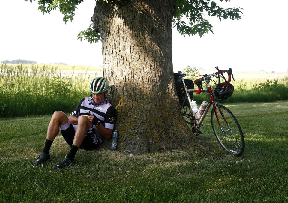 Cyclist Scott Matter of Des Moines finds a shady spot to rest during the RAGBRAI route inspection pre-ride along the day 7 route on Saturday, June 10, 2023.
