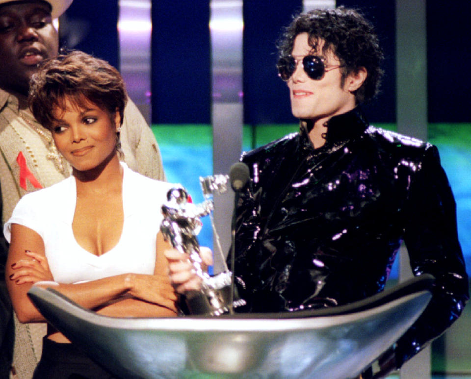 Singer Janet Jackson (L) and her brother Michael Jackson accept an award for "Best Dance Video" at the MTV Video Music Awards, at Radio City Music Hall in New York, September 7