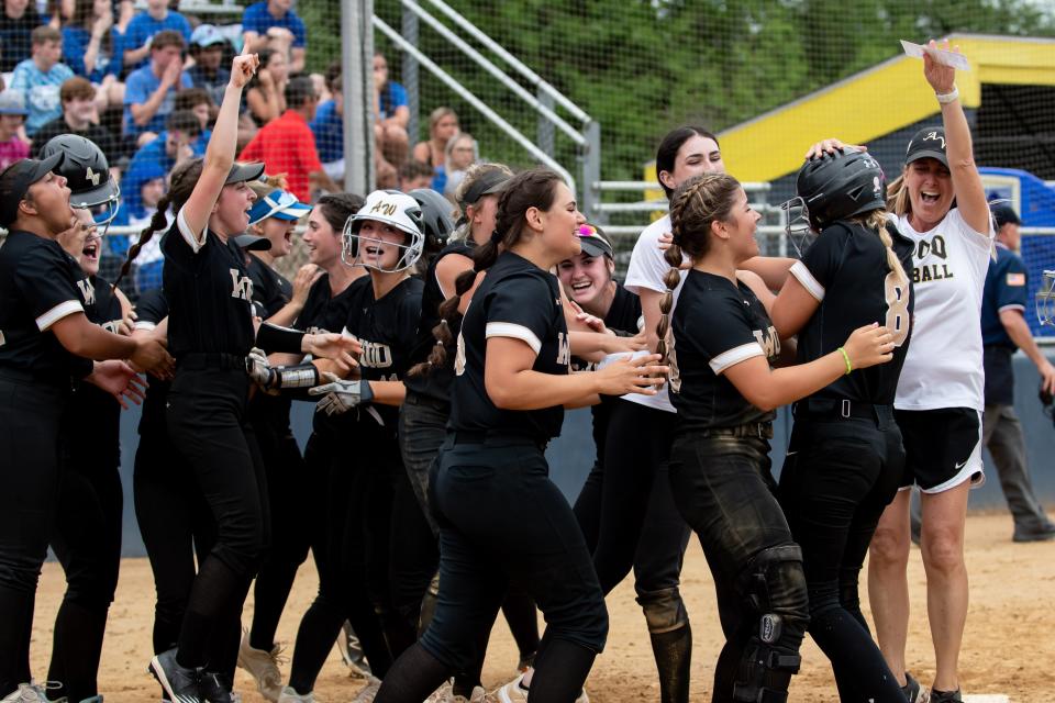 Archbishop Wood players celebrate their 3-2 win over Conwell-Egan in the Philadelphia Catholic League softball championship game Monday.