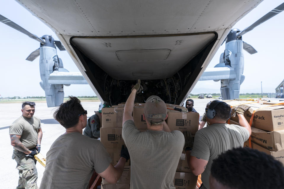 Food is loaded onto a VM-22 Osprey at Toussaint Louverture International Airport, Saturday, Aug. 28, 2021, in Port-au-Prince, Haiti. The VMM-266, "Fighting Griffins," from Marine Corps Air Station New River, from Jacksonville, N.C., are flying in support of Joint Task Force Haiti after a 7.2 magnitude earthquake on Aug. 22, caused heavy damage to the country. (AP Photo/Alex Brandon)