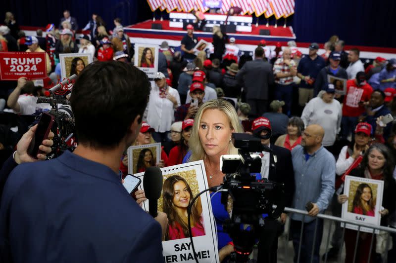 U.S. House Representative Marjorie Taylor Greene greets supporters as she arrives at the rally in Rome, Georgia