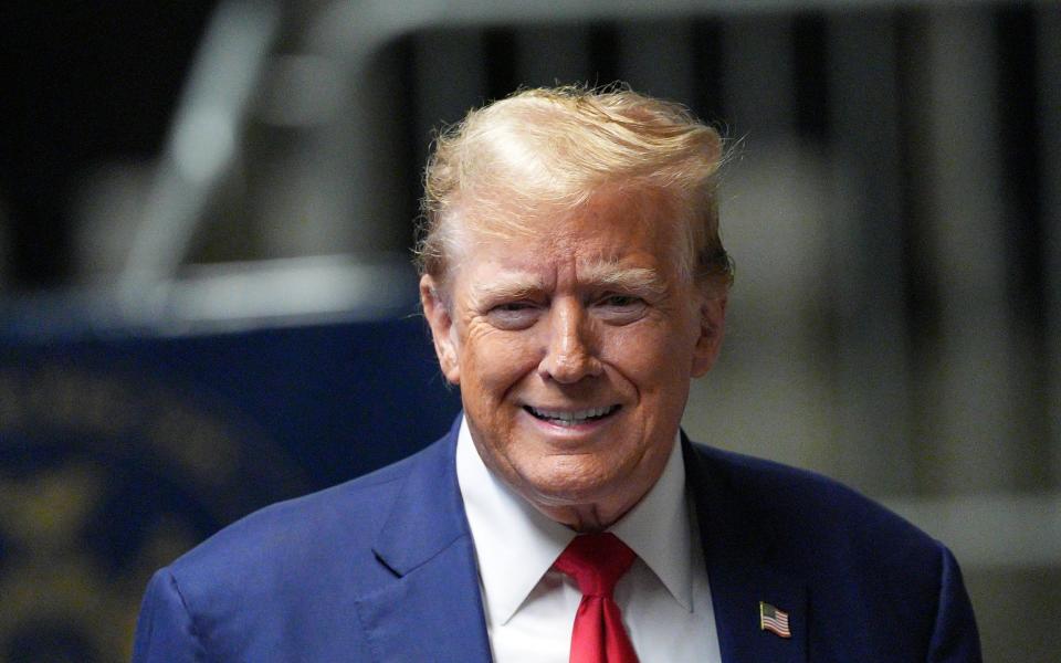 Donald Trump addresses the press before leaving the Manhattan Criminal Court