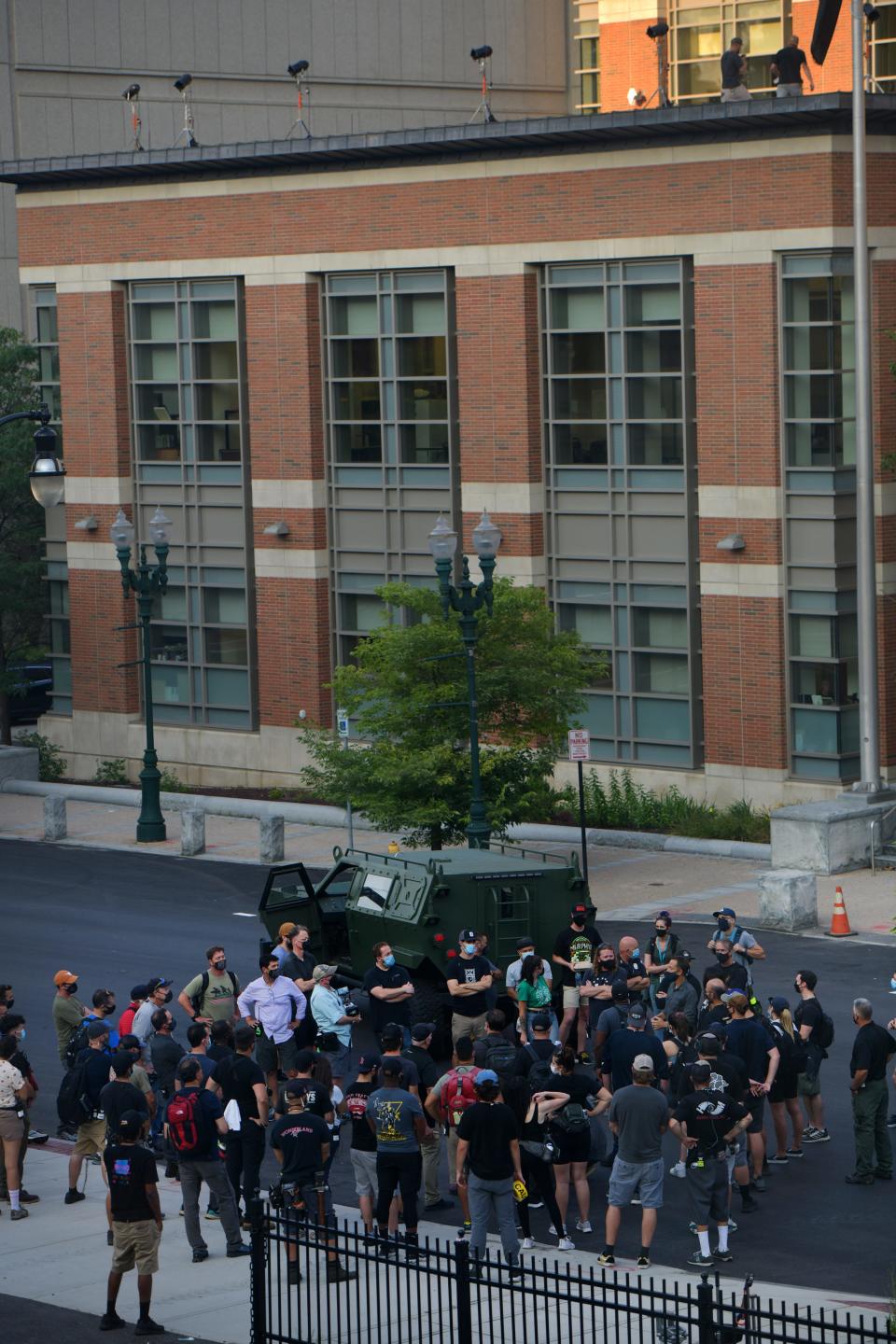 Director Ryan Coogler barked commands on a wireless microphone during filming of “Black Panther: Wakanda Forever” on Main Street, in front of the Worcester Central District Courthouse on Aug. 25, 2021.