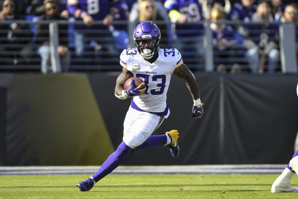 Minnesota Vikings running back Dalvin Cook (33) runs the ball during the first half of an NFL football game against the Minnesota Vikings, Sunday, Nov. 7, 2021, in Baltimore. (AP Photo/Terrance Williams)