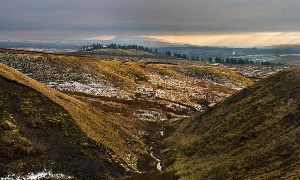 Late afternoon sun falls on Pendle Hill in Lancashire,