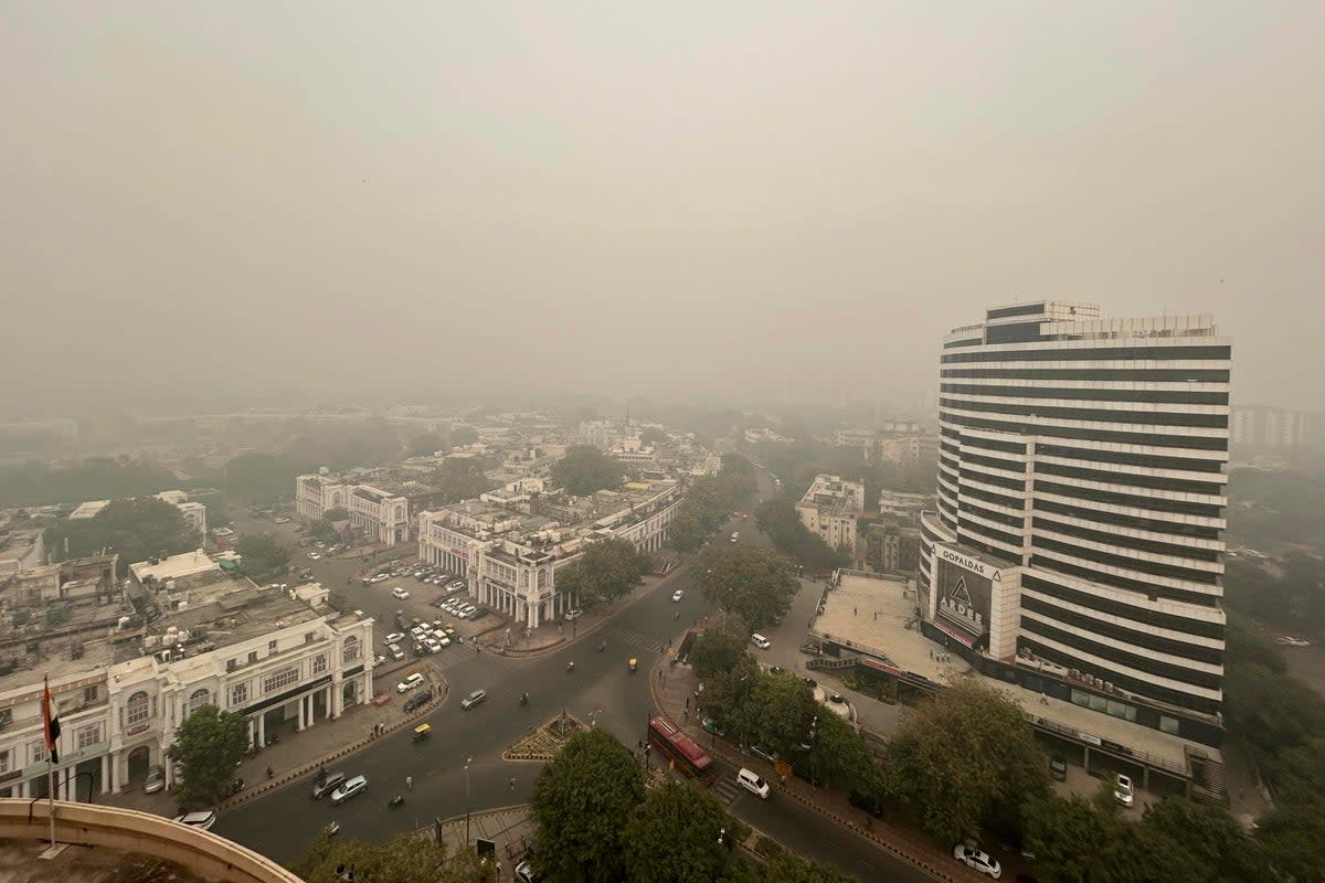 Smog hangs over the city skyline in New Delhi, India (AP)