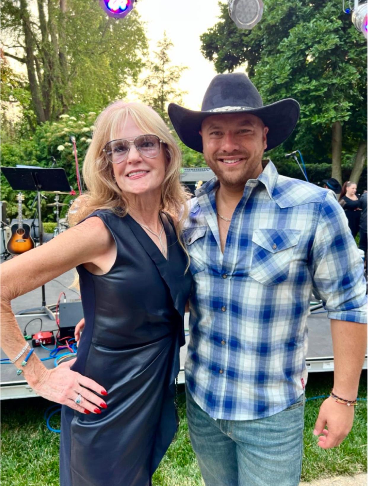 Michael Murphy poses with Leslie Matuszak during a fundraiser she hosted in June.