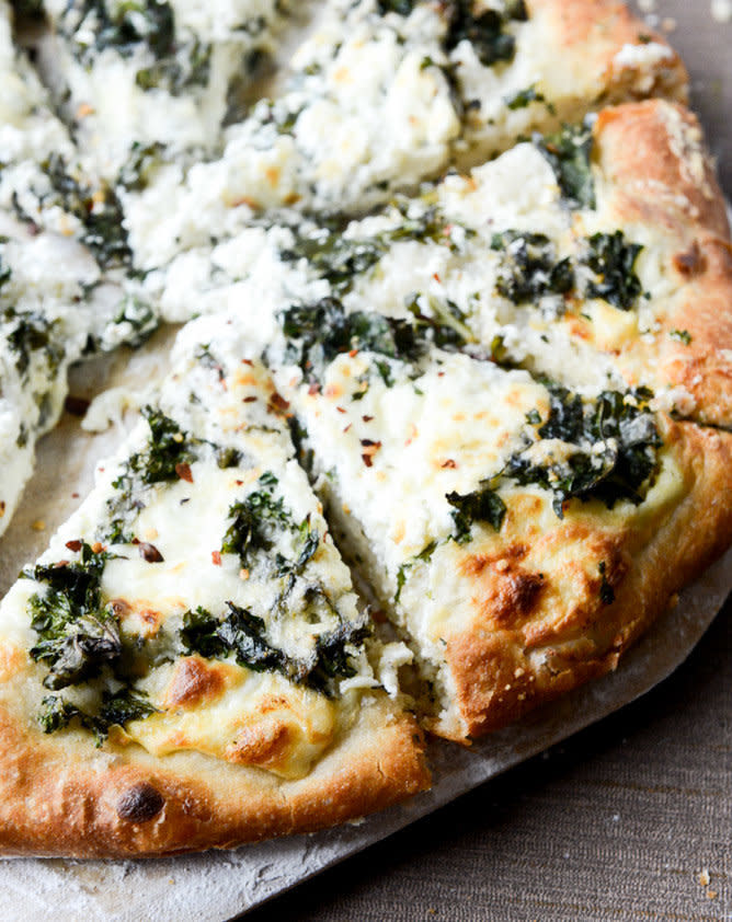 <strong>Get the <a href="http://www.howsweeteats.com/2015/01/marinated-kale-and-whipped-ricotta-pizza/" target="_blank">Marinated Kale and Whipped Ricotta Pizza recipe</a> from How Sweet It Is</strong>