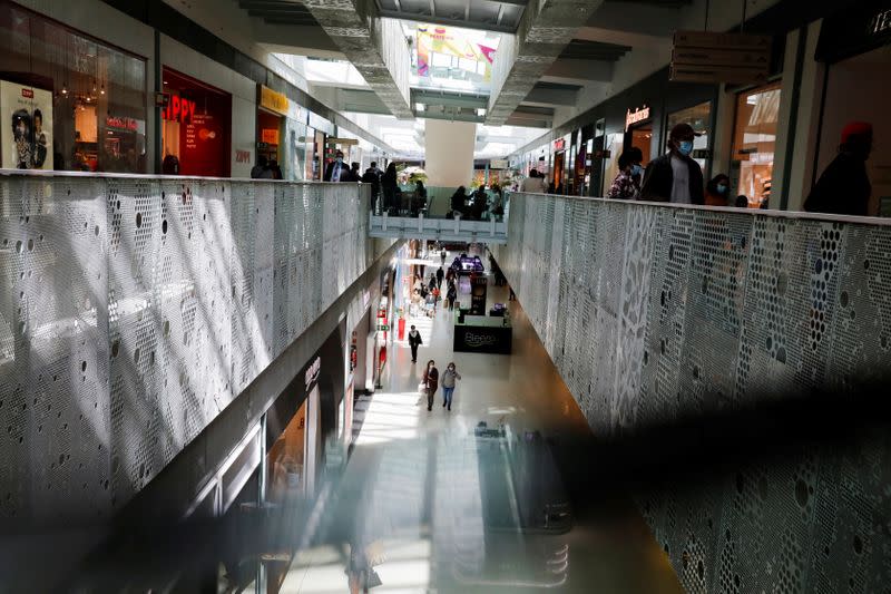 People are seen in a shopping mall on the first day of the opening of malls after a country lockdown, amid the coronavirus disease (COVID-19) pandemic, in Sintra