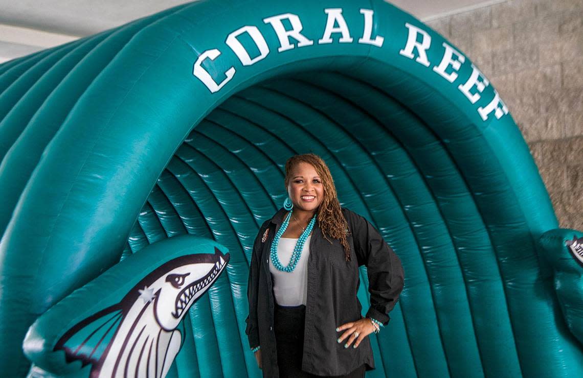 Nyree Washington stands at the entrance of Coral Reef Senior High School on Friday as she gets ready for the beginning of the school year. School starts Wednesday for Miami-Dade County Public Schools.