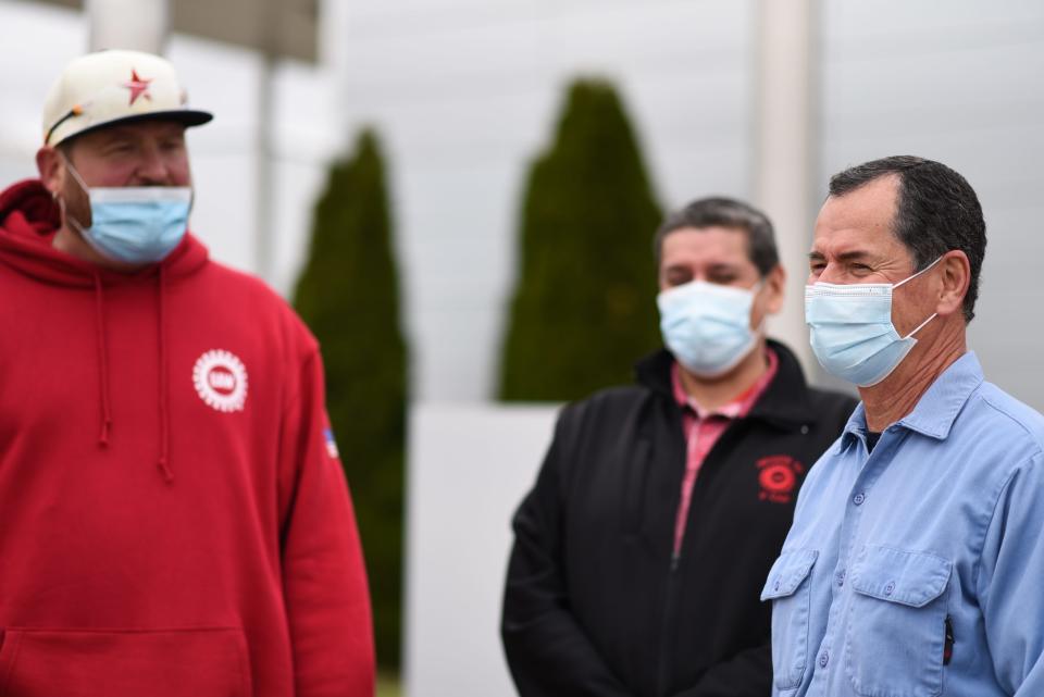 GM Delta Plant workers Jeff Kosloski  left, and Mike Huerta, talk about co-worker Steve Delaney, right, Wednesday, May 5, 2021, and Delaney's 50-year tenure at the plant.